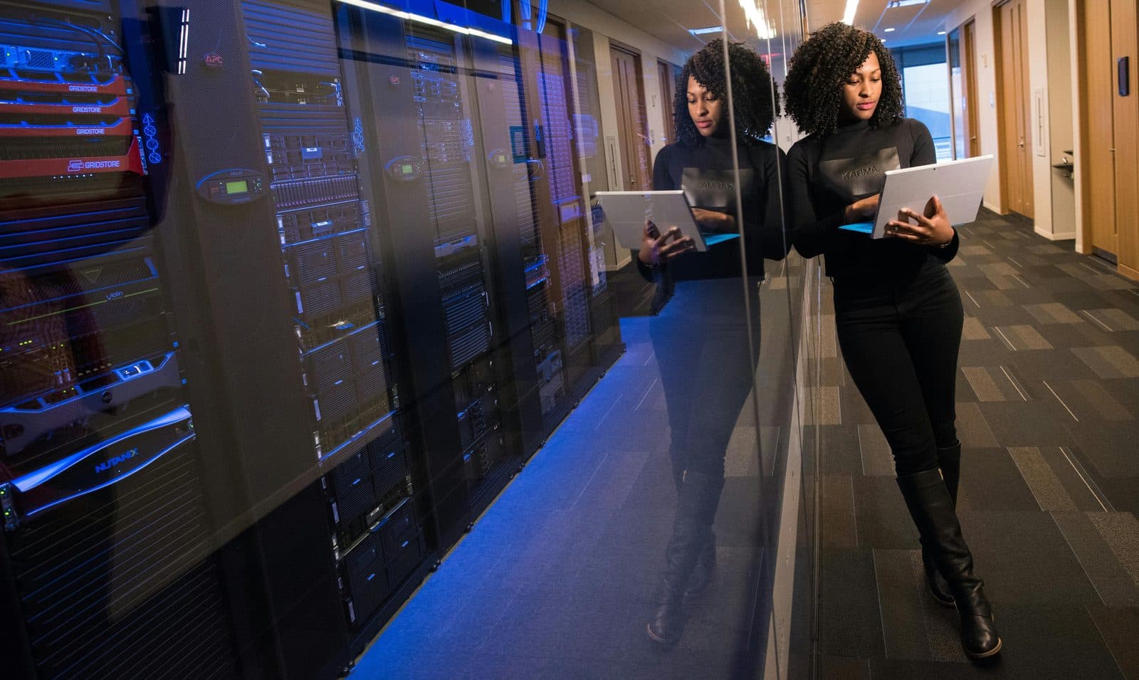 Specialist working near data centre server racks